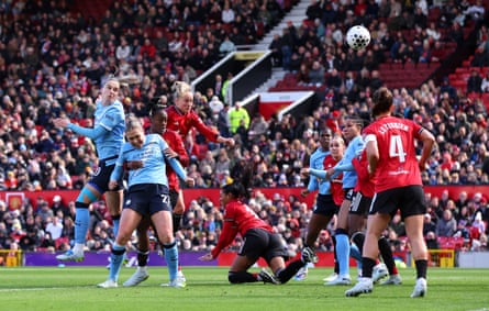 Manchester City’s Vivianne Miedema heads home their first goal in the Manchester derby.