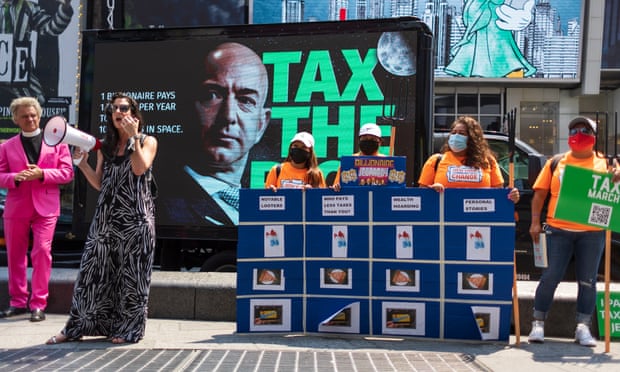 People take part in a small rally calling for a higher tax rate on the wealthiest Americans in Times Square in New York last month.