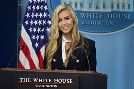 Katie Zacharia smiles while speaking at a White House press briefing podium
