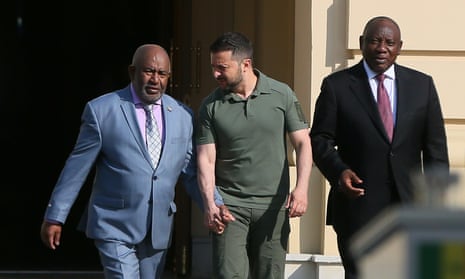 Azali Assoumani, Volodymyr Zelenskiy and Cyril Ramaphosa, the presidents of Comoros, Ukraine and South Africa, walk to a press conference following their meeting in Kyiv