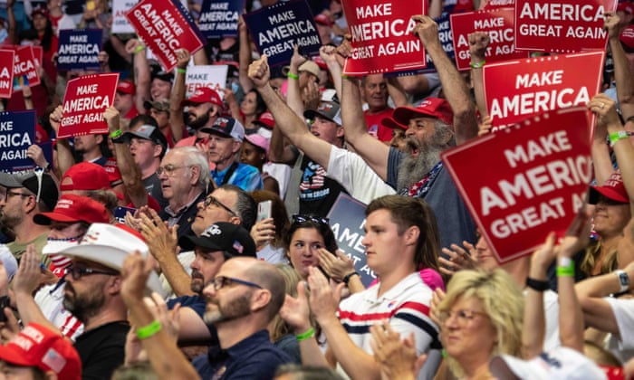 Trump supporters without face masks cheer and applaud in the stands during a rally of US president Donald Trump in Tulsa, Oklahoma, on 20 June, 2020.