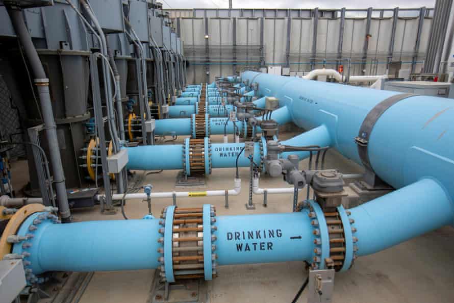 Blue tubes are marked ‘drinking water’ at a water desalination plant.