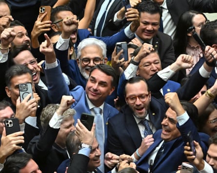 Flavio Bolsonaro (centre), celebrates with Conservative members of Brazil’s congress