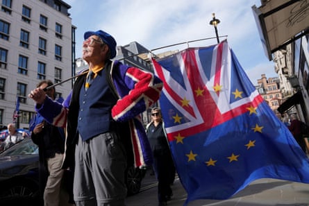A protester in London with a mixed EU/Union Jack flag.
