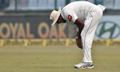Suranga Lakmal vomits during the fourth day of their third test cricket match against India in New Delhi, India.