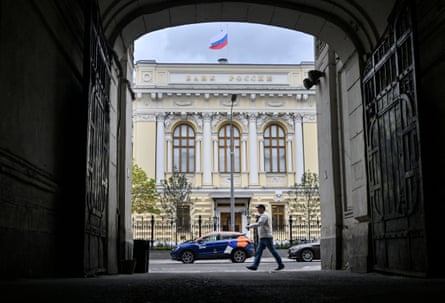 A man walks past the Russian central bank headquarters in Moscow.