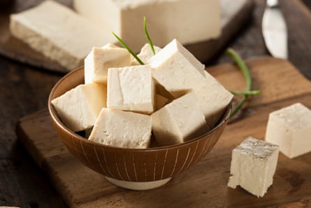 cubes of tofu in a bowl on kitchen counter