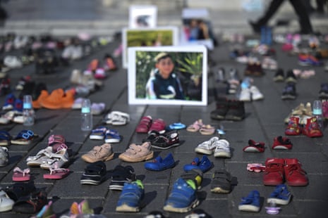 A view of the shoes and pictures of children left in Istanbul.