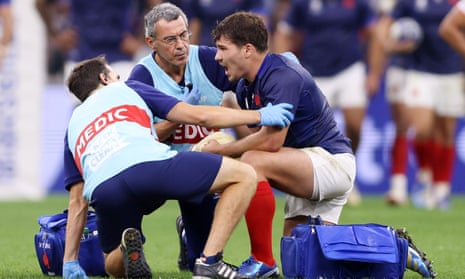 Antoine Dupont receives treatment for his injury against Namibia