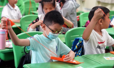 Children learning handicrafts at a school in Shanghai