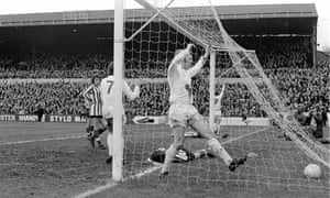 Leeds’ Allan Clarke (behind post) celebrates after Roger Fry deflects in his shot. His teammate Mick Jones, whose run in to the net confused Southampton’s defenders, also celebrates.
