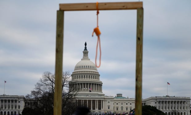 A noose is seen on makeshift gallows as supporters of Donald Trump gather outside the Capitol.