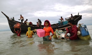 Rohingya Muslims flee from Myanmar’s Rakhine state to Bangladesh by boat.