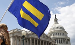 A supporter of LGBT rights holds up an “equality flag” on Capitol Hill in Washington. 3846.jpg?width=300&quality=85&auto=forma