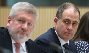 Communications minister Mitch Fifield sits beside the acting managing director of the ABC, David Anderson,