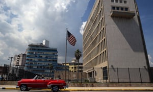 A classic car passes in front of the US embassy in Havana, Cuba, 16 June 2017, where diplomats suffered hearing loss and other symptoms