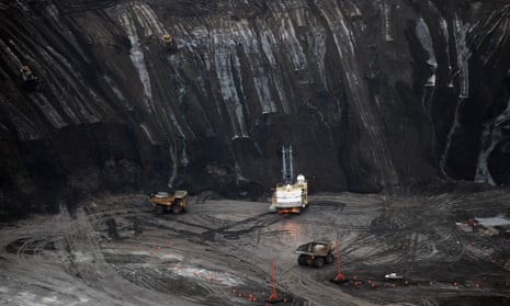 A large excavator loads a truck with oil sands at the Shell Albian mine in Alberta. British-Dutch oil giant Royal Dutch Shell has announced the sale of$8.5bn of oil sands assets in Canada.