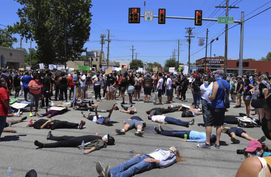 People lie down Peoria Avenue in Tulsa during a demonstration sparked by the death of George Floyd.
