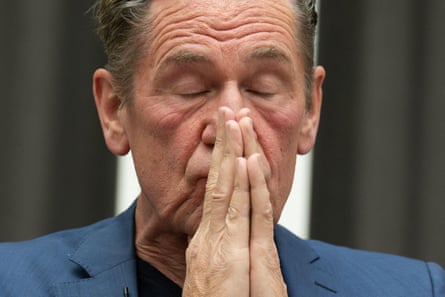 Mathias Döpfner has his hands together as if in prayer