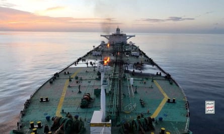 Flames and smoke rise from the oil tanker Sounion on the Red Sea, seen from above with close-up on the deck
