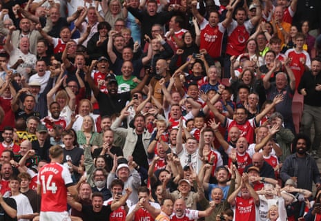 Viktor Gyokeres celebrates scoring their third goal in front of cheering Arsenal fans.