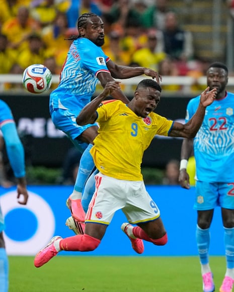 Jhon Cordoba and Samuel Moutoussamy battle for the ball