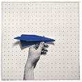 a hand holding a blue paper plane