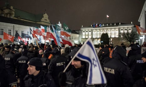 Supporters of the far-right National Radical Camp (ONR) gather in support of the Holocaust bill in front of the presidential palace in Warsaw on 5 February.