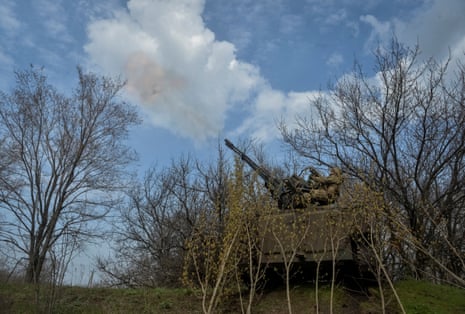 Ukrainian servicemen fire a military vehicle with anti-aircraft cannon.