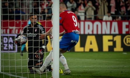 Artem Dovbyk retrieves the ball from Granada goalkeeper Marc Martínez after scoring his first penalty.