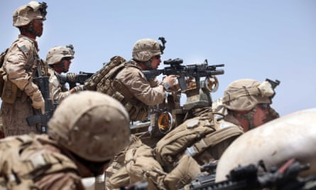 Marines pick out enemy targets as they receive incoming fire in Main Poshteh, Afghanistan.