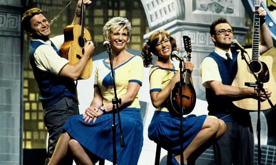 With John Michael Higgins, Parker Posey and Christoper Moynihan in A Mighty Wind (2003), directed by Christopher Guest. Playing musical instruments.