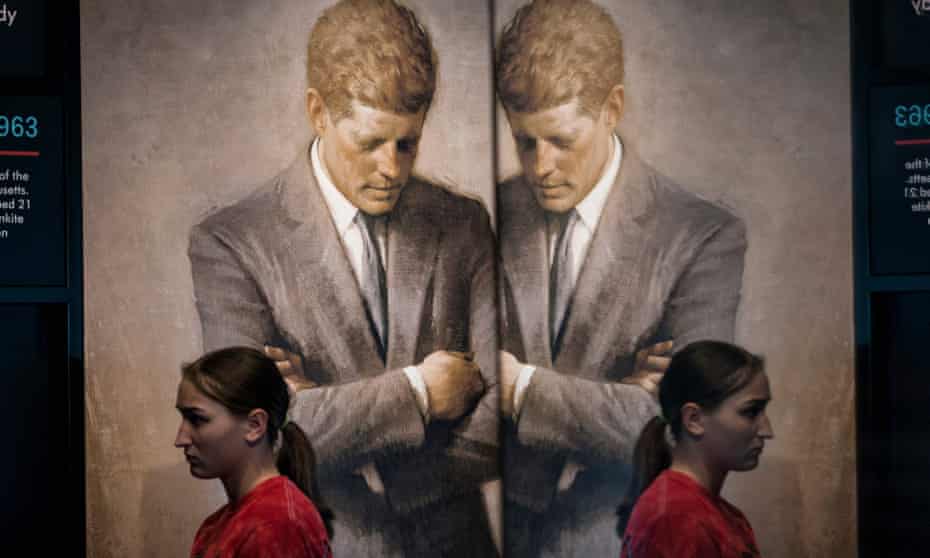 Student walks by JFK's official portrait, by Aaron Shikler