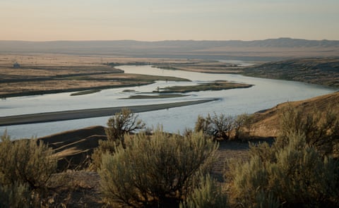 The Columbia River flows next to a decommissioned nuclear production complex in Washington state.