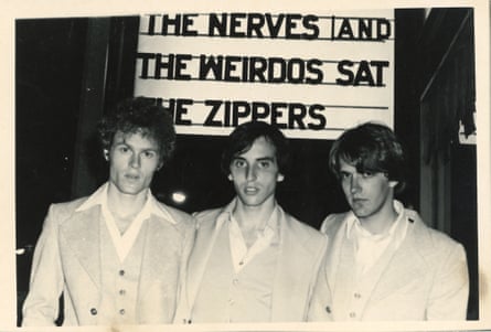 Lee, Collins and Case of the Nerves in Los Angeles in 1977. behind the suited band members is a theatre sign saying the nerves and the weirdos sat the zippers