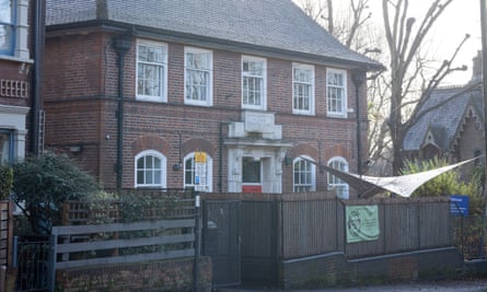 The Konstam Centre in Highgate, north London – a pleasant-looking, historic redbrick building with white-painted window frames and stone doorway, behind a fence and bushes