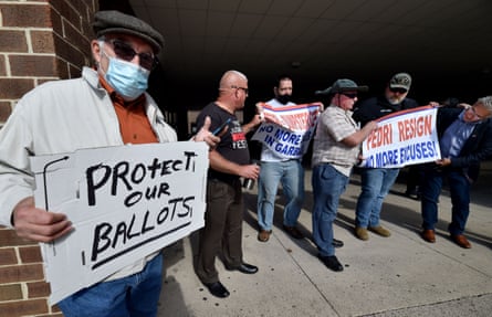 People protest outside Penn Place, where the Luzerne county elections board is located.