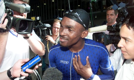 Eric Moussambani of Equatorial Guinea is surrounded by the media during the Sydney Olympics, September 2000.