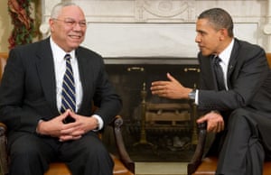Then US president Barack Obama speaks with Powell during a meeting in the Oval Office of the White House in Washington DC in 2010