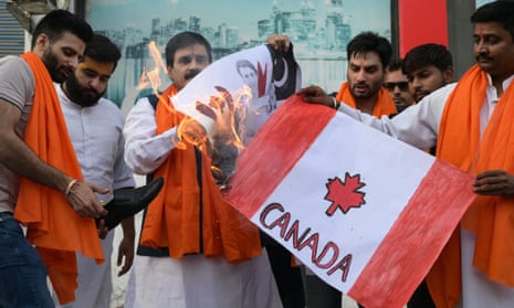 Activists of Shiv Sena Taksali set on fire banners depicting Canada's national flag during a rally in Amritsar 