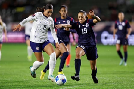 Sophia Smith of the United States dribbles the ball against Gabriella Cuevas of the Dominican Republic