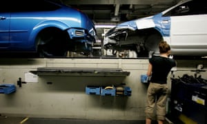 An employee works on the production line of a Ford Focus at the Ford plant in Saarlouis, Germany, in 2007.