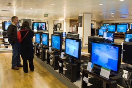 Electronics department of big retailer with TV screens