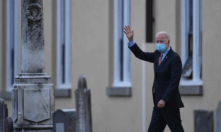 Joe Biden waves his hand as he leaves St Joseph's on Brandywine Roman Catholic Church on January 16, 2021 in Wilmington, Delaware.