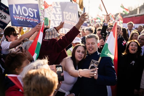 Péter Magyar, leader of the Tisza party, center right, greets supporters during a rally ahead of a general election in Budapest, Hungary.