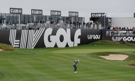 Oliver Bekker plays on to the 18th green as fans watch on from adjacent terraces