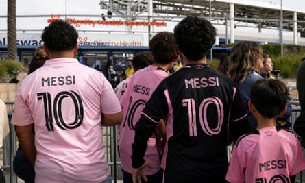 Fans with jerseys of Inter Miami’s Lionel Messi wait to enter the stadium before the match against LA Galaxy.