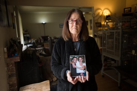 woman holds photo of couple