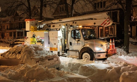 Emergency crews work to restore power in Buffalo, New York.