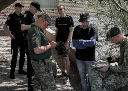 Pimakhov, Pikhota and police officers with two non-uniformed men 